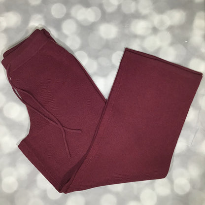 Flat lay of the LuLaRoe Carma Bottom in a solid merlot wine color, showing the ribbed waistband, adjustable drawcord, relaxed full-length leg, and soft micro rib sweater knit fabric