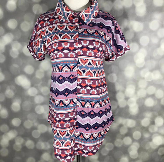 Front view of mannequin wearing LuLaRoe Charlie Button Up Shirt in blue and mauve boho stripe print with short sleeves and button front