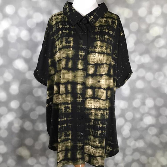 Front view of mannequin wearing LuLaRoe Charlie Button Up Shirt in olive and black tie-dye grid pattern with short sleeves and button front