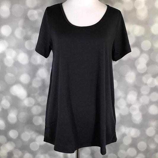 Front view of LuLaRoe Classic T on mannequin in solid black, featuring short sleeves, scoop neckline, and flattering longer back hem