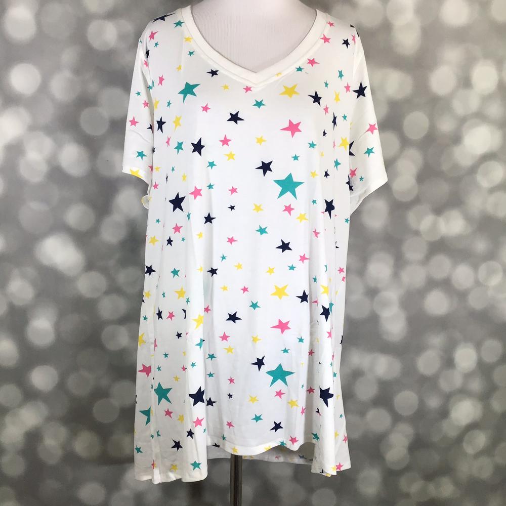 LuLaRoe Christy T featuring Confetti Starburst print with colorful teal, navy, pink, and yellow stars scattered across a white background, relaxed fit V-neck top for women.