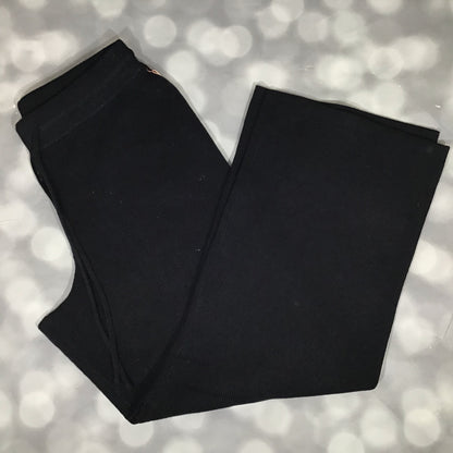 Flat lay of the LuLaRoe Carma Bottom in solid black, featuring a ribbed waistband with drawstring, relaxed full-length legs, and soft micro rib sweater knit fabric