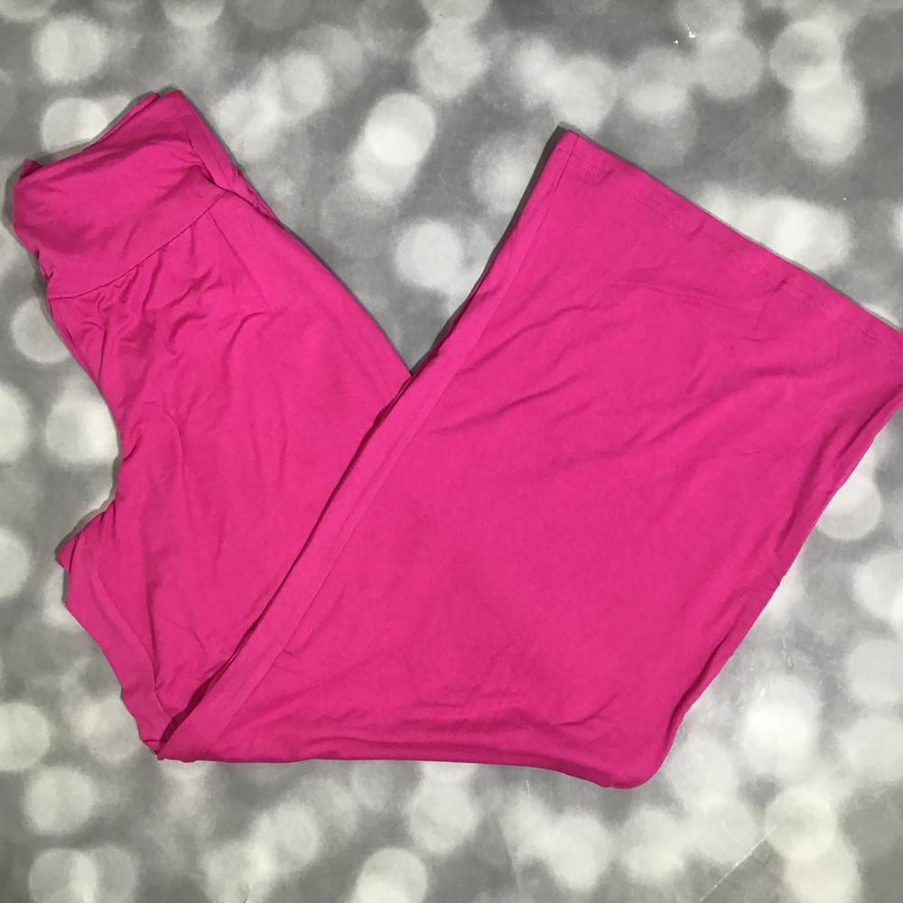 LuLaRoe Essential Wide Leg Pant in solid electric fuchsia featuring relaxed wide-leg silhouette and comfortable waistband on a gray background