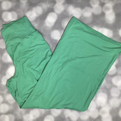LuLaRoe Essential Wide Leg Pant in solid emerald green featuring relaxed wide-leg silhouette and comfortable waistband on a gray background