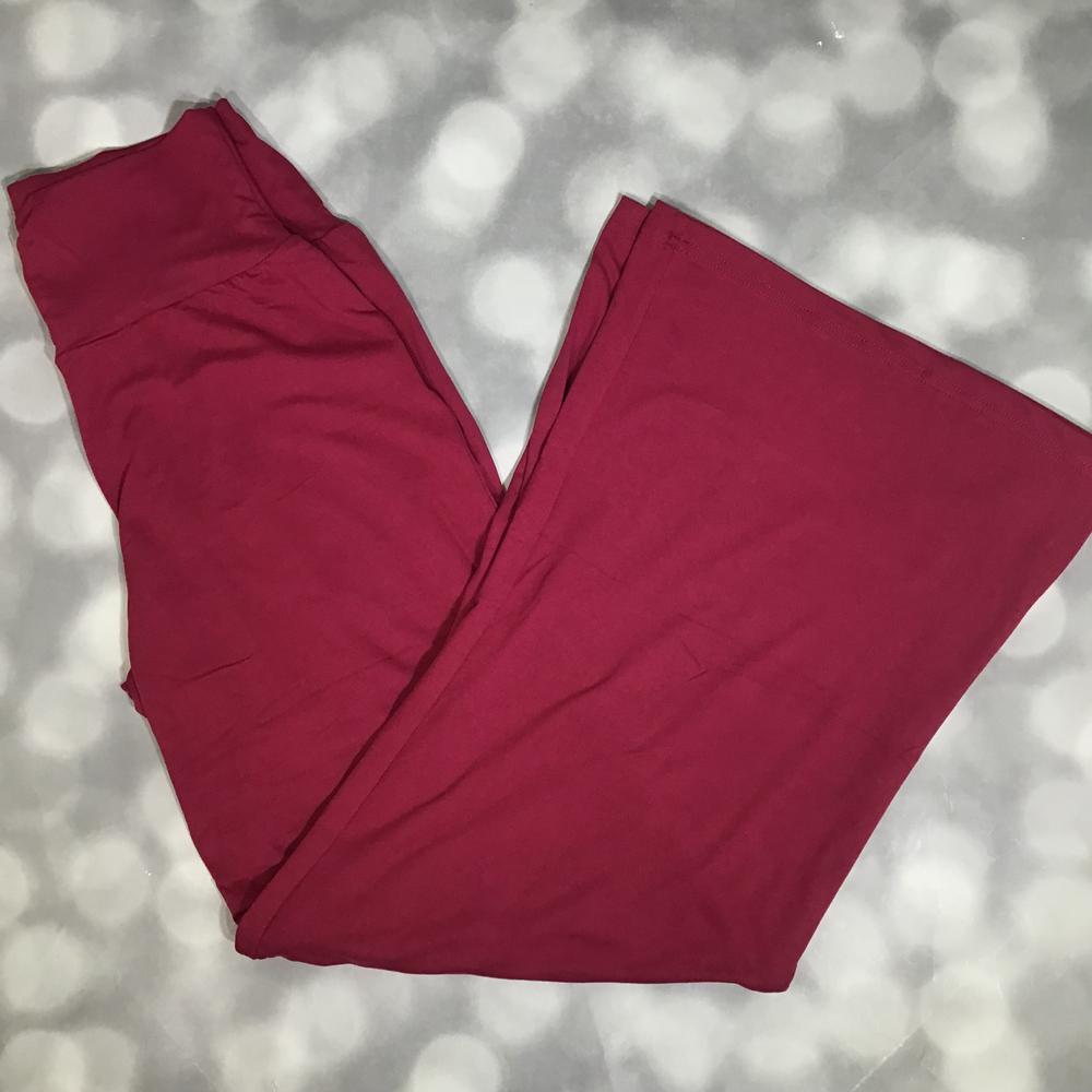 LuLaRoe Essential Wide Leg Pant in solid garnet red featuring relaxed wide-leg silhouette and comfortable waistband on a light gray background