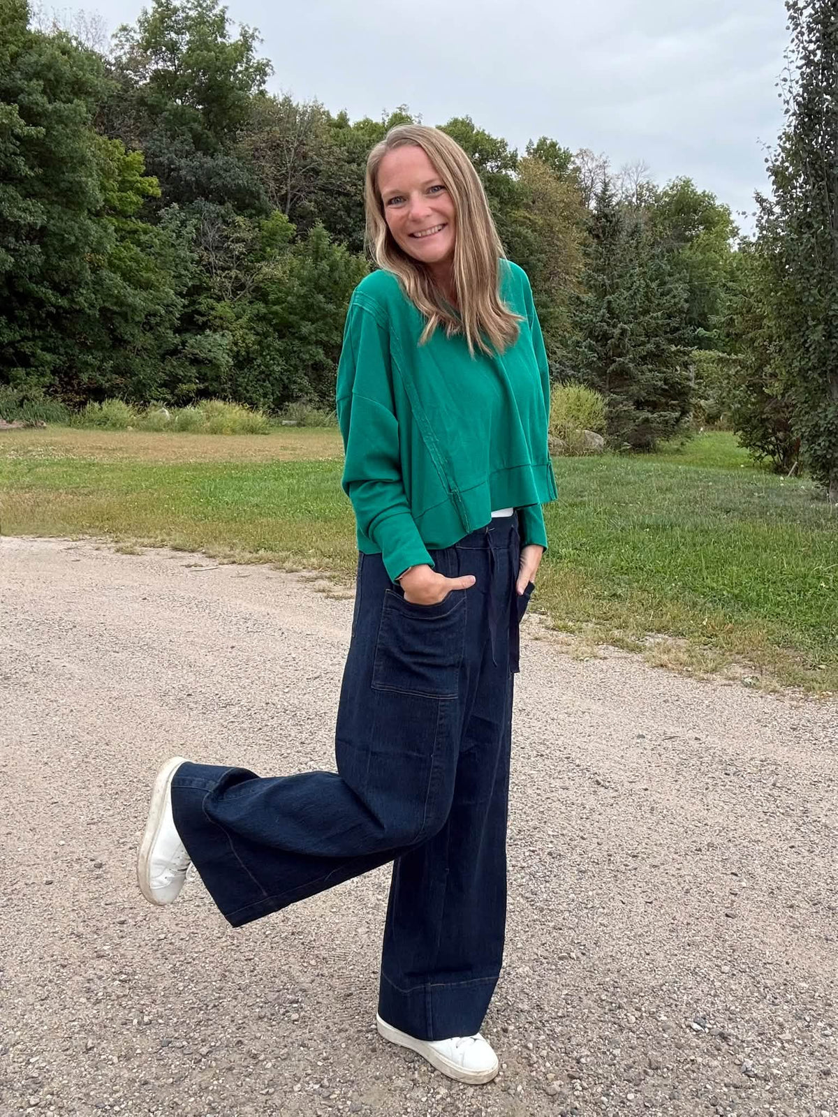 Lifestyle view 3 of the LuLaRoe Wendy Easy Barrel Pull-On Pant in Solid Emerald Green