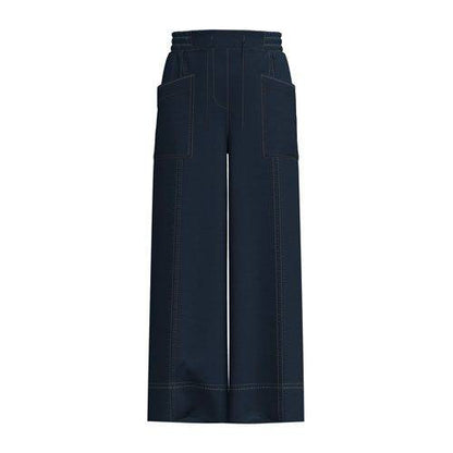 Model wearing the LuLaRoe Pull-On Patch Pocket Pant in Indigo Wash with a wide-leg silhouette, drawstring waist and front patch pockets.