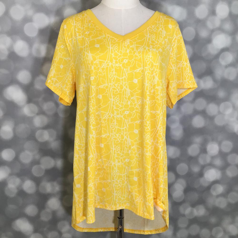 LuLaRoe Christy T featuring Lemon Blossom Sketch print with white floral line-art flowers on a bright lemon yellow background, relaxed fit V-neck top for women.