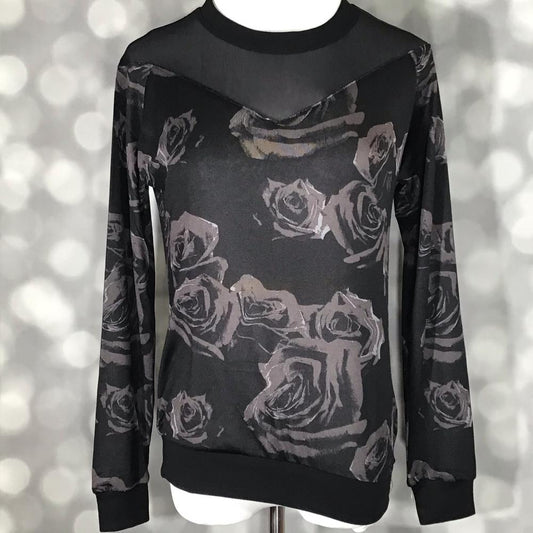 LuLaRoe Lizzy sweater in black with gray rose floral print and black mesh yoke, lightweight hacci fabric with ribbed details on a mannequin against a blurred background