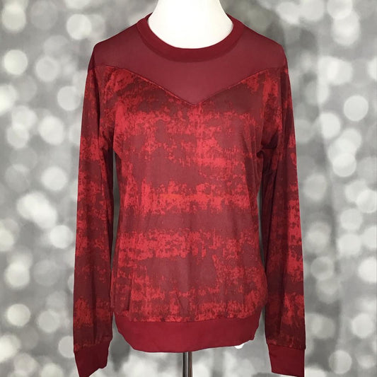 LuLaRoe Lizzy Sweater in textured crimson red with matching mesh yoke, ribbed trim, and lightweight sweater knit fabric on a mannequin against a blurred gray background