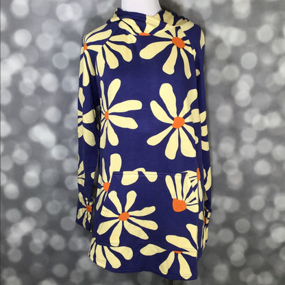 LuLaRoe Amber Hoodie in Cobalt Daisy Pop with blue background and oversized yellow daisy floral print, hooded neckline, and kangaroo pocket featuring relaxed fit, long sleeves, soft stretch fabric shown on a mannequin on a blurred gray background