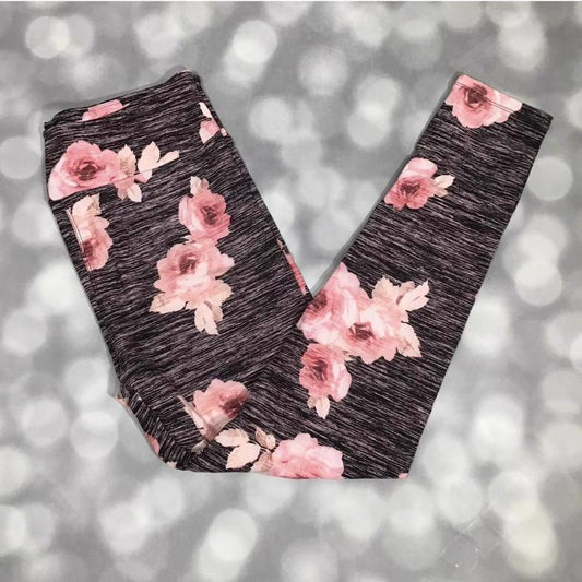 LuLaRoe leggings with blush pink rose floral print on a dark charcoal heather background