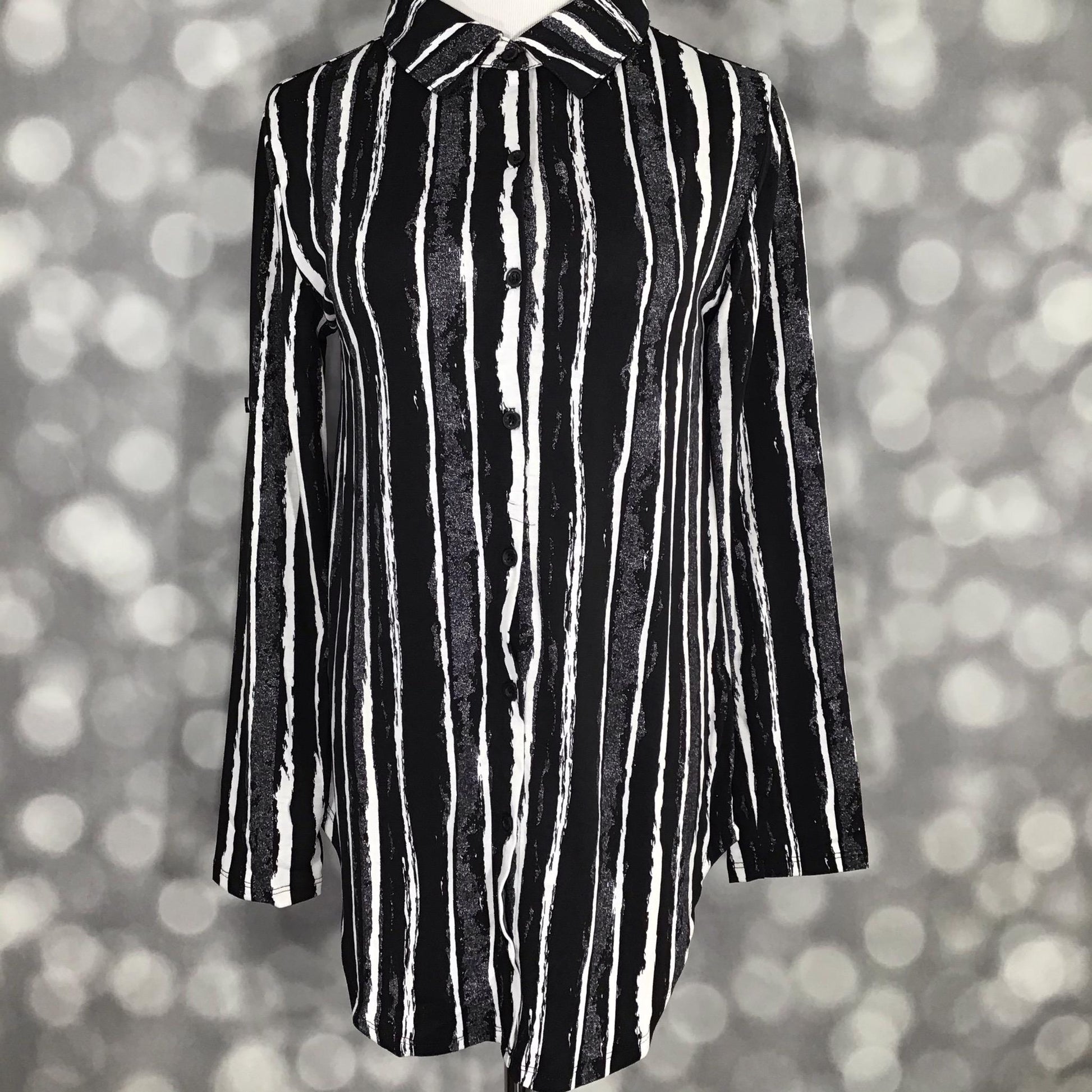 LuLaRoe button-down top with black and white abstract vertical stripes in a modern hand-drawn pattern