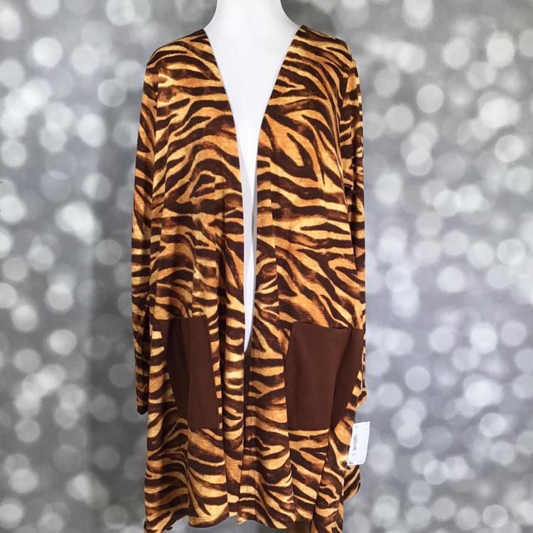 LuLaRoe Caroline cardigan in golden tiger stripe print with solid brown pockets, open front, and mid-thigh length.