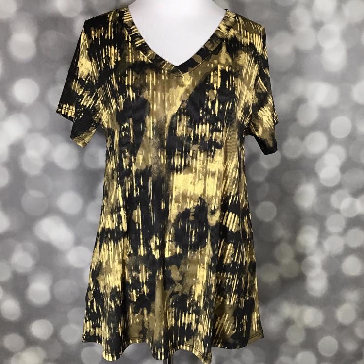 LuLaRoe Christy T top in black and golden yellow abstract grunge texture print with relaxed fit and V-neck silhouette displayed on mannequin