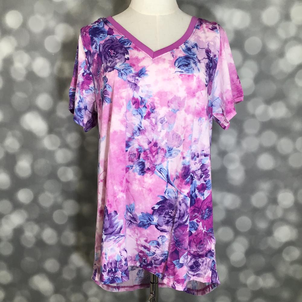 LuLaRoe Christy T in Blush, Plum & Cobalt Watercolor Floral, featuring blush, plum and cobalt florals over a softly washed pink background, a flattering V-neckline, short sleeves and a relaxed fit.