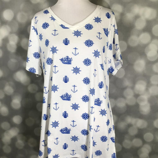LuLaRoe Christy T featuring blue nautical sketch illustrations including anchors, sailing ships, compass roses, and ship wheels on a white background displayed on a mannequin against a silver bokeh backdrop.