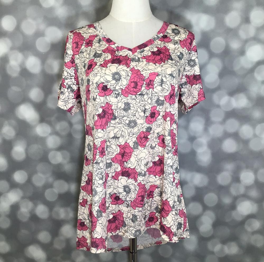 LuLaRoe Christy T in Ivory, Fuchsia & Charcoal Sketched Floral, featuring fuchsia blossoms and charcoal sketched florals on an ivory background, a flattering V-neckline, short sleeves and a relaxed fit.