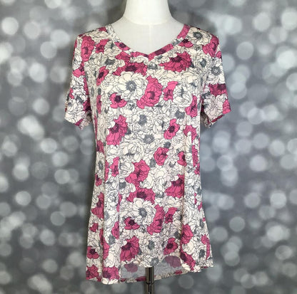 LuLaRoe Christy T in Ivory, Fuchsia & Charcoal Sketched Floral, featuring fuchsia blossoms and charcoal sketched florals on an ivory background, a flattering V-neckline, short sleeves and a relaxed fit.