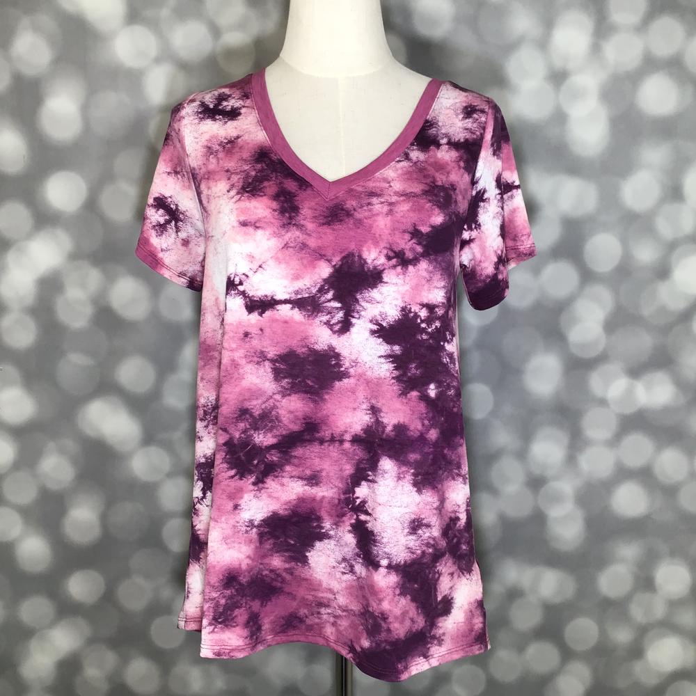 LuLaRoe Christy T in Plum, Magenta & Blush Cloud Tie-Dye, featuring cloud-like plum, magenta and blush tie-dye, a flattering V-neckline, short sleeves and a relaxed fit.
