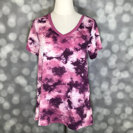 LuLaRoe Christy T in Plum, Magenta & Blush Cloud Tie-Dye, featuring cloud-like plum, magenta and blush tie-dye, a flattering V-neckline, short sleeves and a relaxed fit.