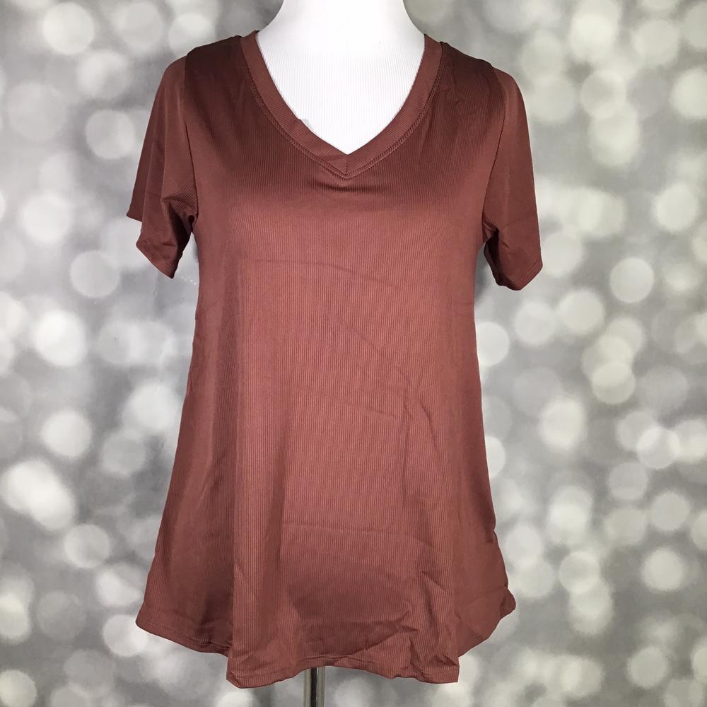 LuLaRoe Christy T in Solid Cinnamon Brown, featuring a warm cinnamon-brown color, a flattering V-neckline, short sleeves and a relaxed fit.