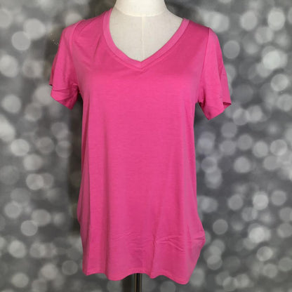 LuLaRoe Christy T in Solid Fuchsia Pink, featuring a vivid fuchsia-pink color, a flattering V-neckline, short sleeves and a relaxed fit.