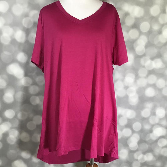 LuLaRoe Christy T in solid raspberry sangria featuring a relaxed V-neck swing silhouette displayed on a mannequin against a silver bokeh background.