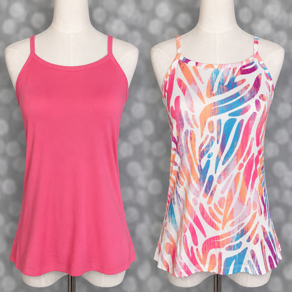 LuLaRoe Essential cami set displayed on mannequin forms featuring a solid bubblegum pink camisole paired with a colorful abstract tropical print cami in pink, coral, blue, and orange tones on a gray bokeh background.