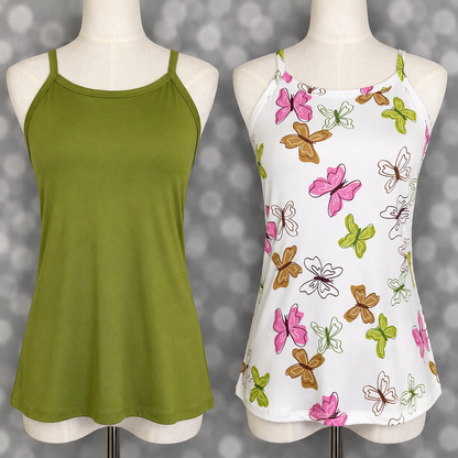 Two LuLaRoe Essential camis shown on mannequins including a solid olive green camisole and a white cami with pink, green, and tan butterfly print against a soft gray bokeh backdrop.