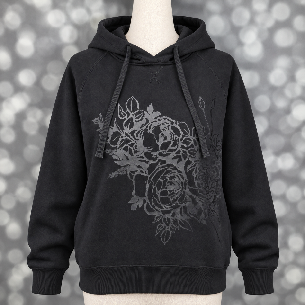 Women’s LuLaRoe Graphic Hoodie in black with a charcoal tonal floral design, shown on a mannequin.