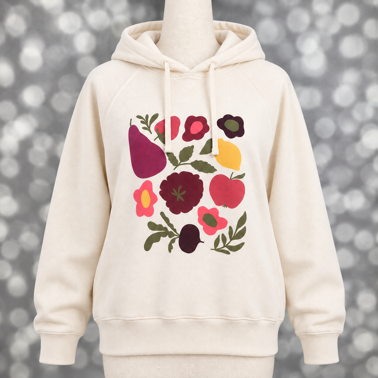 Women’s LuLaRoe Graphic Hoodie in soft ivory with a multicolor fruit and floral design, shown on a mannequin.