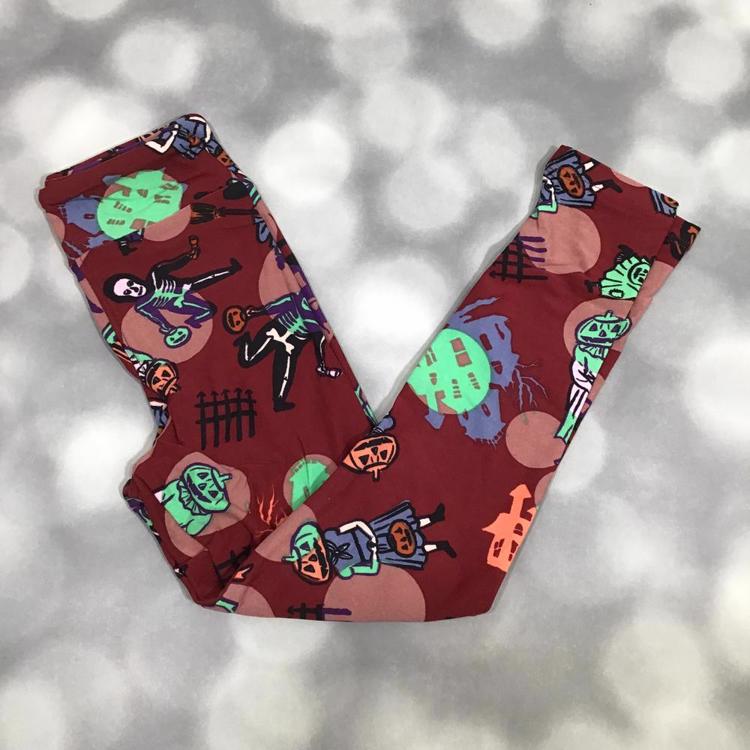 LuLaRoe Halloween leggings in red with skeletons, pumpkins, haunted houses, and spooky character print.