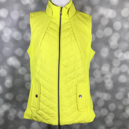 LuLaRoe Hunter zip-up vest in bright neon citron yellow with chevron quilted front, diamond quilted shoulders, ribbed collar, zipper closure, and snap pocket details displayed on a mannequin against a blurred gray background