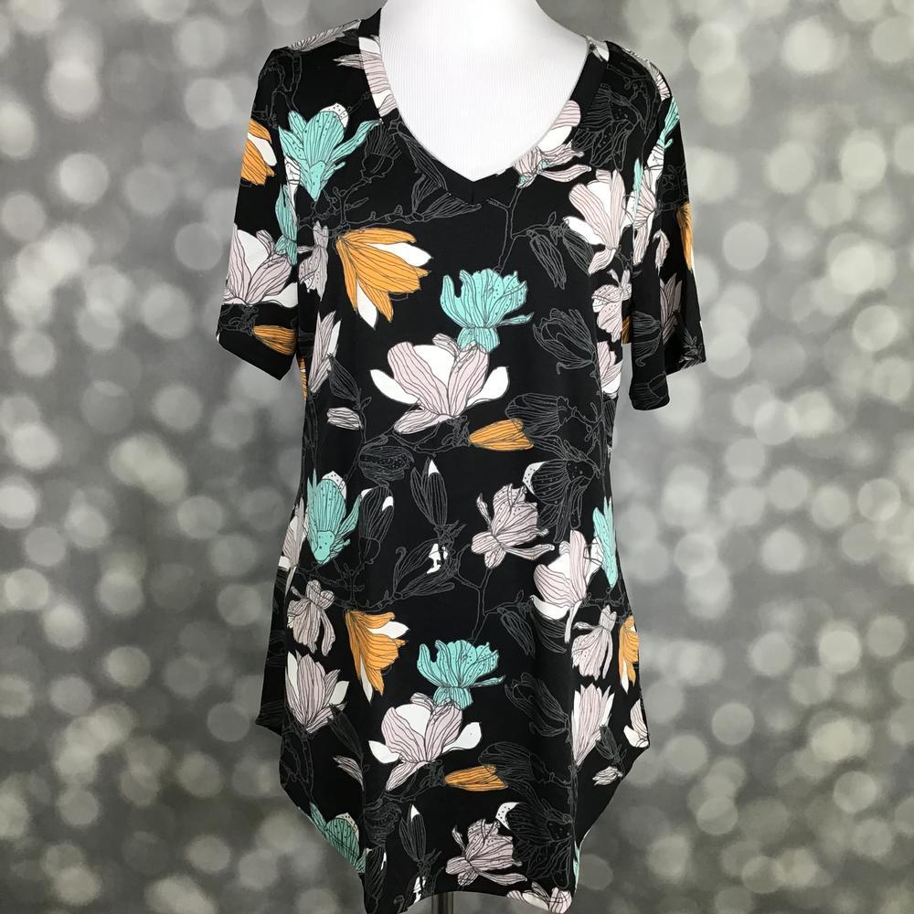 LuLaRoe Iris Tee in Midnight Magnolia featuring a black background with oversized ivory, aqua mint, blush, and golden floral blooms, rounded v-neckline, relaxed sleeves, and tunic-length silhouette.