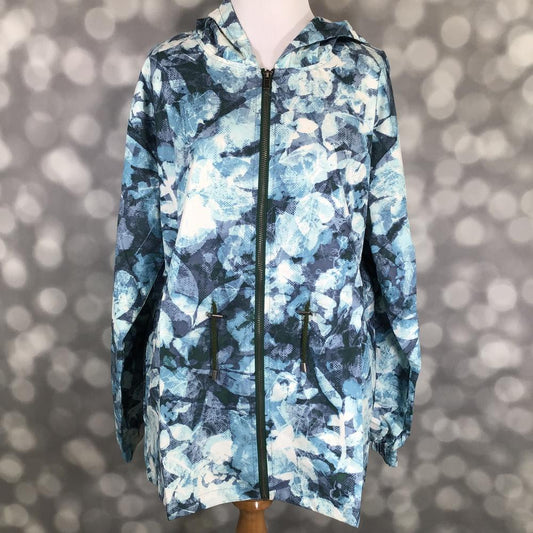 Floral patterned jacket on a mannequin against a blurred background
