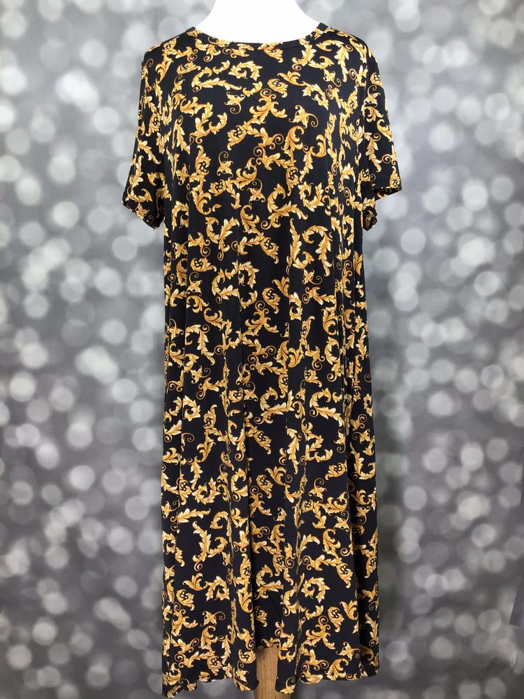 Front view of LuLaRoe Jessie dress on mannequin in black with ornate gold baroque swirl print, short sleeves, and flowy swing fit