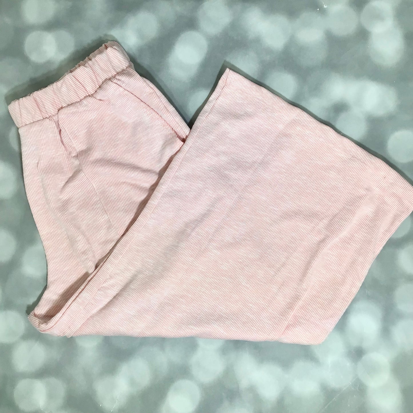 LuLaRoe Justine Pant in Solid Ballet Pink featuring a soft blush pink solid color, relaxed wide leg silhouette, elastic waistband, comfortable pull-on women's fashion pant.