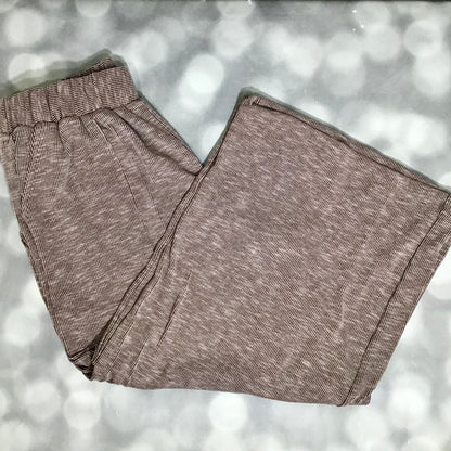 LuLaRoe Justine Pant in Solid Cocoa Truffle featuring a rich cocoa brown solid color, relaxed wide leg silhouette, elastic waistband, comfortable pull-on women’s fashion pant on a light gray background