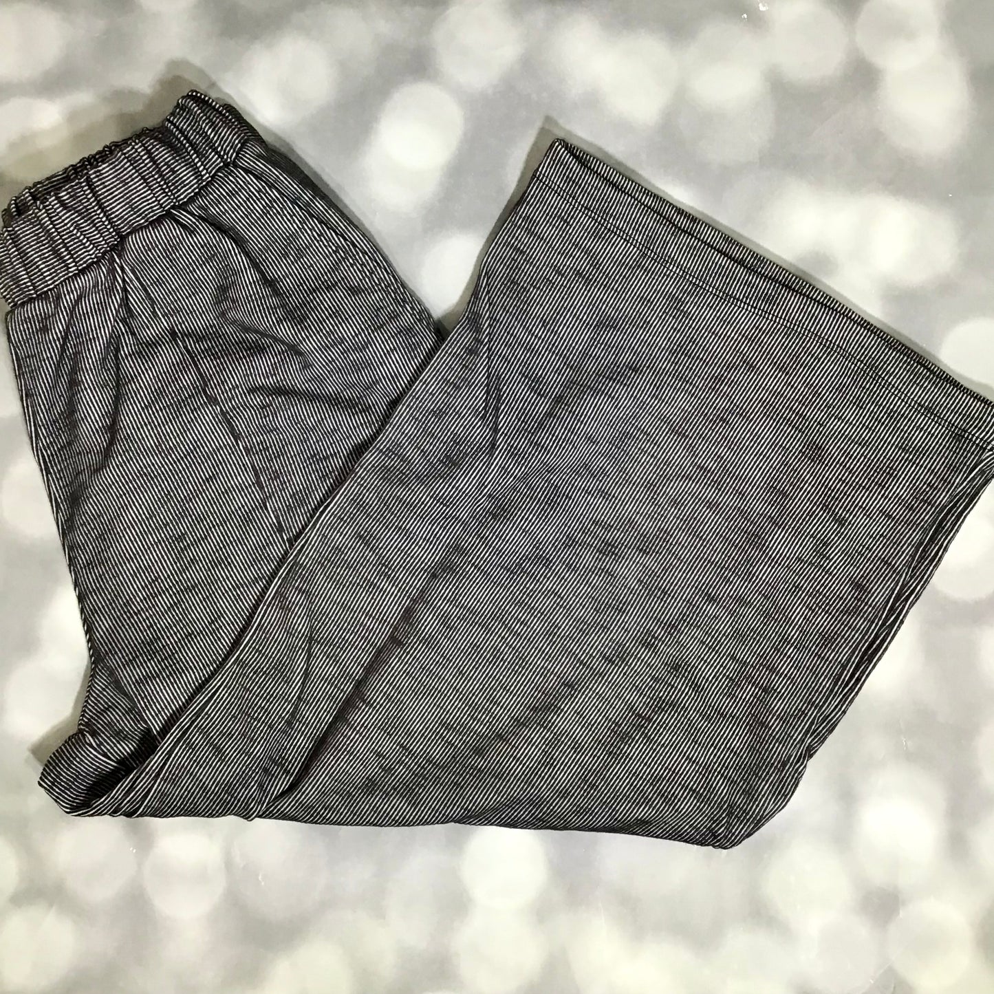 LuLaRoe Justine Pant in Solid Deep Charcoal featuring a rich charcoal gray solid color, relaxed wide leg silhouette, elastic waistband, comfortable pull-on women's fashion pant.