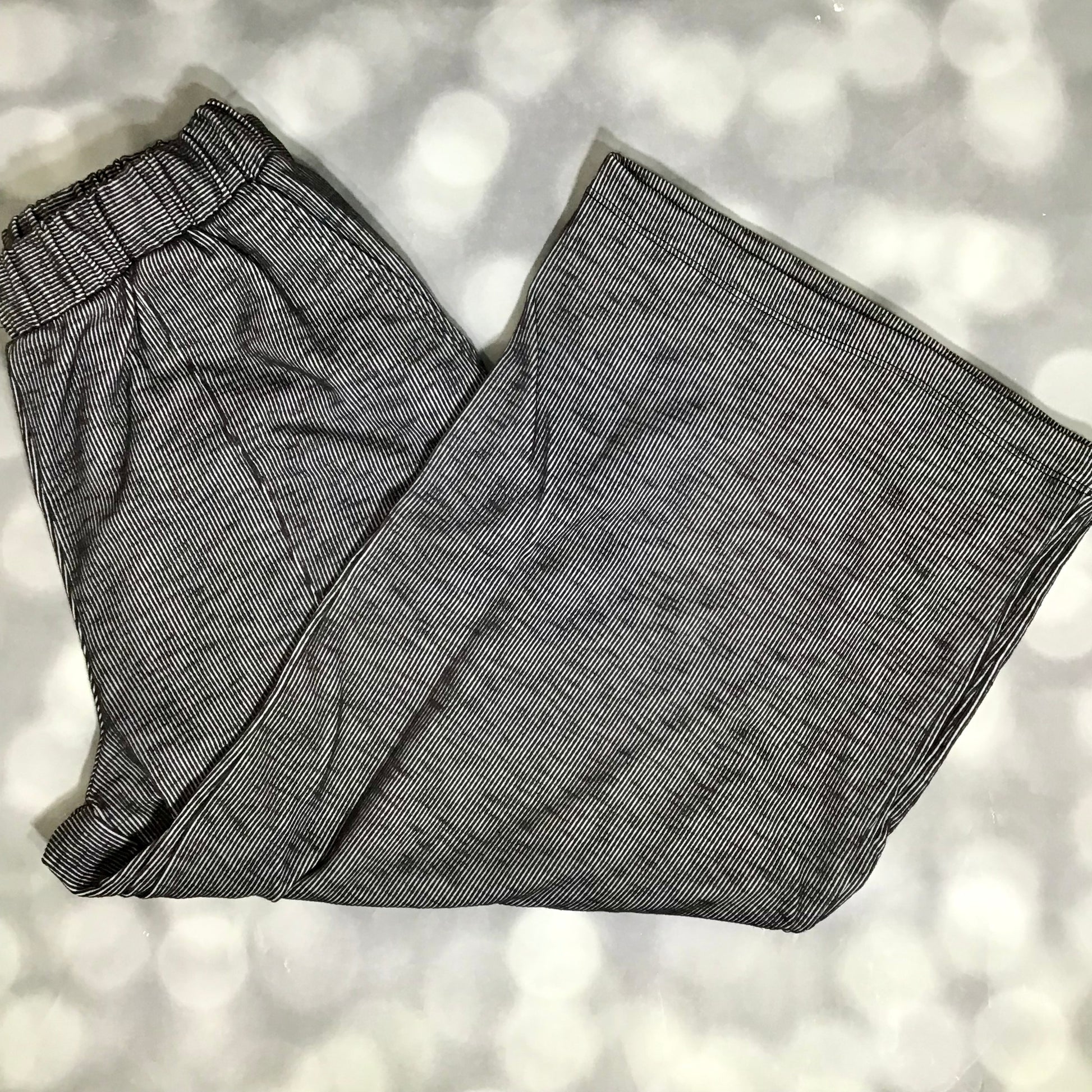 LuLaRoe Justine Pant in Solid Deep Charcoal featuring a rich charcoal gray solid color, relaxed wide leg silhouette, elastic waistband, comfortable pull-on women's fashion pant.