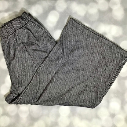 LuLaRoe Justine Pant in Solid Deep Charcoal featuring a rich charcoal gray solid color, relaxed wide leg silhouette, elastic waistband, comfortable pull-on women's fashion pant.