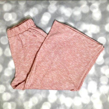 LuLaRoe Justine Pant in Solid Desert Rose featuring a warm dusty rose solid color with terracotta undertones, relaxed wide leg silhouette, elastic waistband, and comfortable pull-on styling.