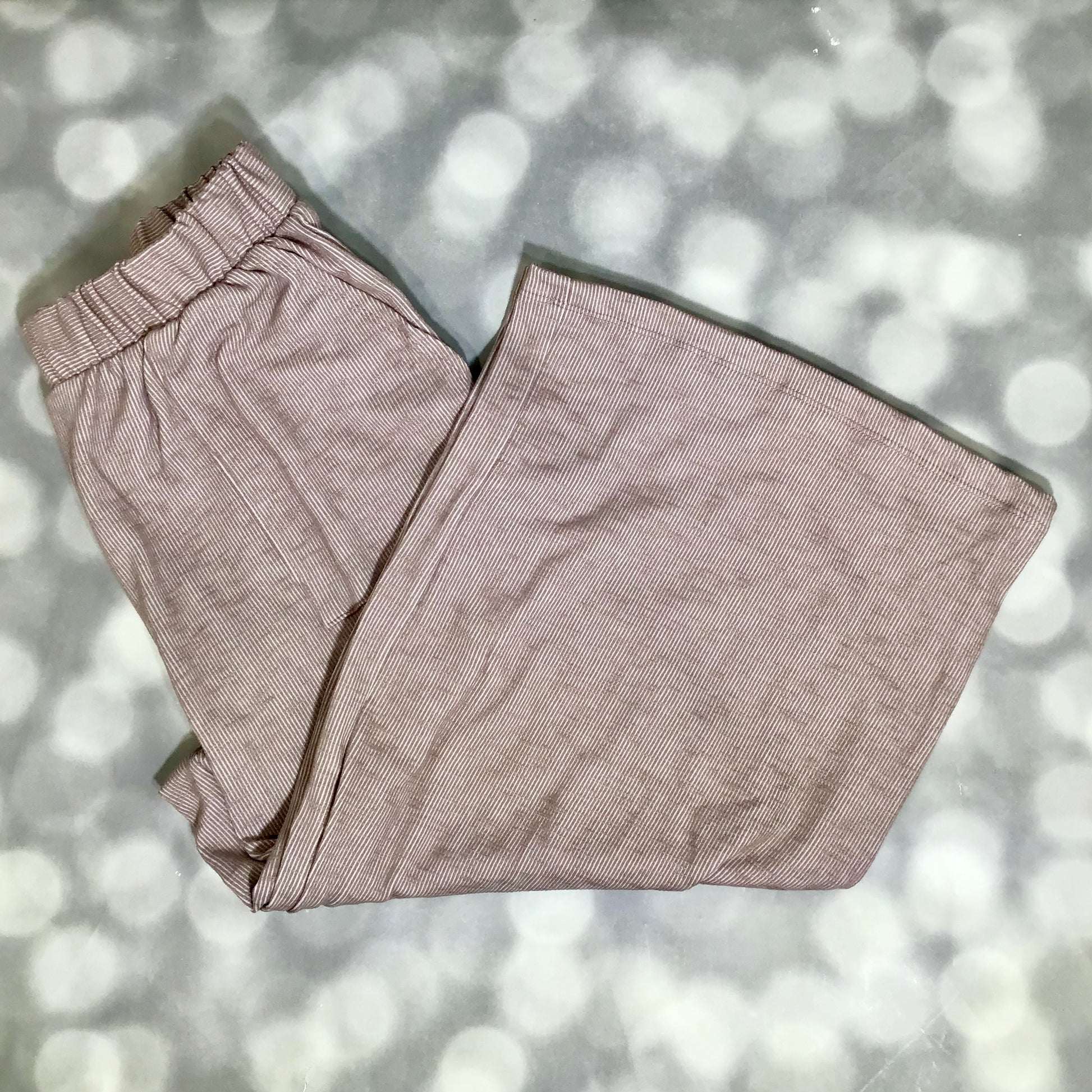LuLaRoe Justine Pant in Solid Dusty Rosewood featuring a soft dusty mauve taupe solid color, relaxed wide leg silhouette, elastic waistband, comfortable everyday women's fashion pant.