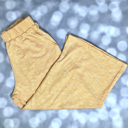LuLaRoe Justine Pant in Solid Golden Honey featuring a warm golden yellow solid color, relaxed wide leg silhouette, elastic waistband, comfortable pull-on women's fashion pant.
