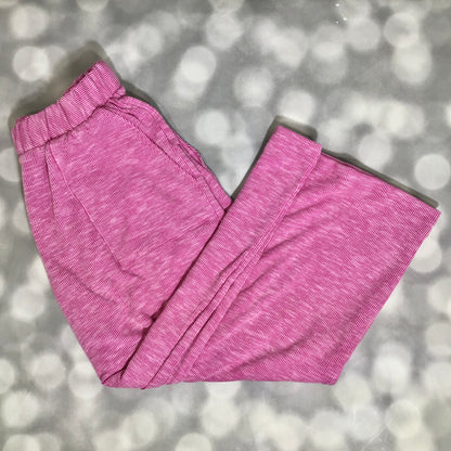 LuLaRoe Justine Pant in Solid Raspberry Orchid featuring a vibrant raspberry pink solid color, relaxed wide leg silhouette, elastic waistband, comfortable pull-on women’s fashion pant on a gray textured background