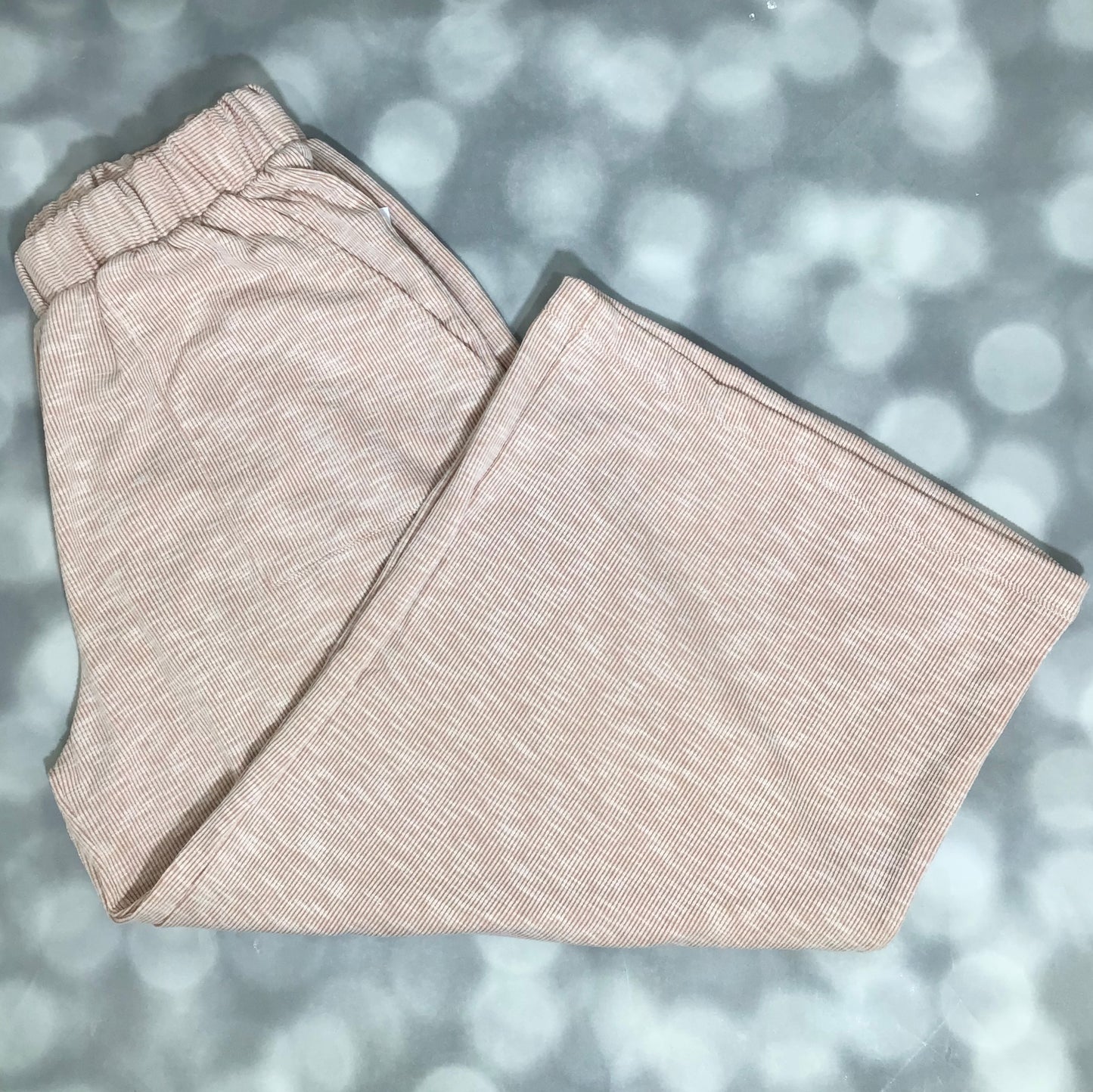LuLaRoe Justine Pant in Solid Sandstone Beige featuring a soft warm beige solid color, relaxed wide leg silhouette, elastic waistband, and comfortable pull-on styling for everyday wear.
