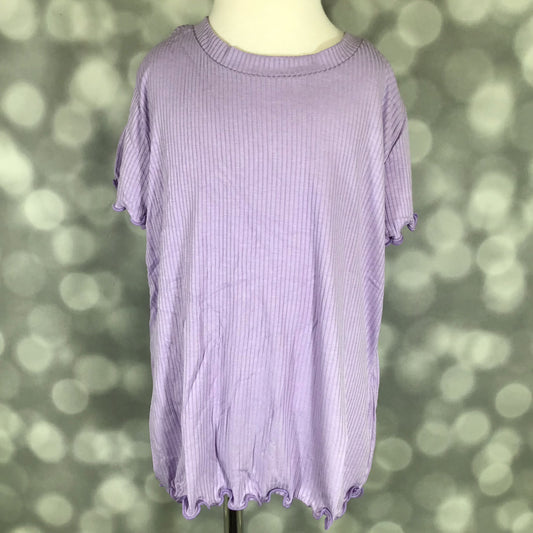 LuLaRoe Lacey Top in solid purple rose violet with ribbed fabric and lettuce-edge hem on a mannequin with a bokeh background