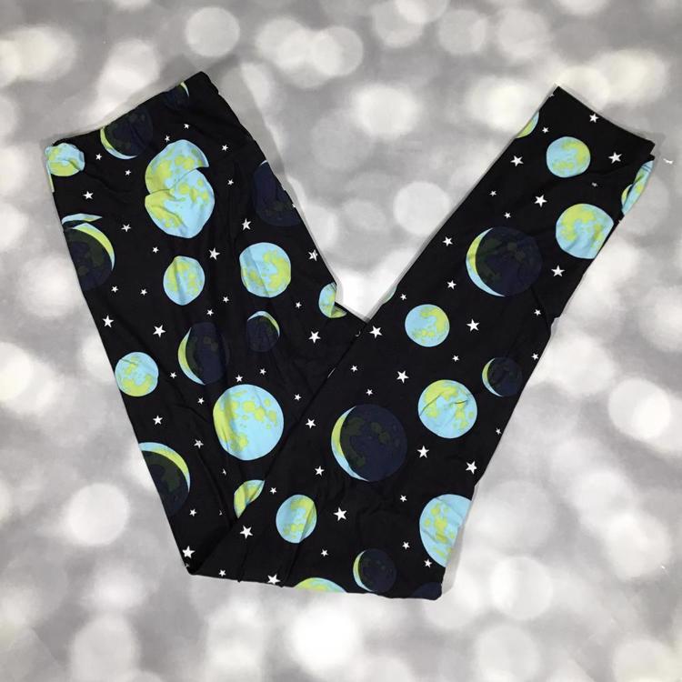 LuLaRoe black leggings featuring blue and green planet and star print - celestial orbit pattern