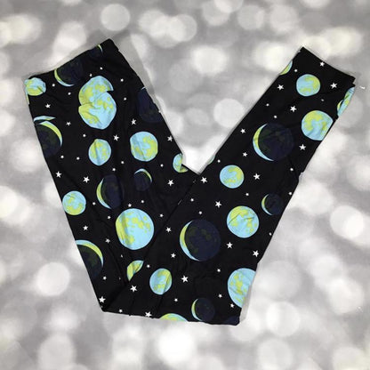 LuLaRoe black leggings featuring blue and green planet and star print - celestial orbit pattern